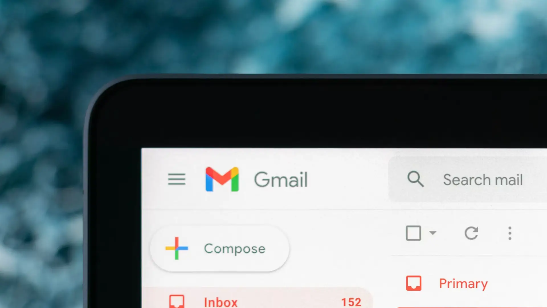 Gmail on a Macbook Air laptop screen with a blurred background.
