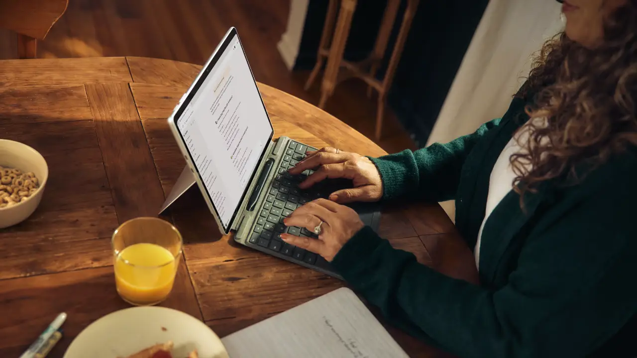 A Woman Uses AI On A Microsoft Surface Tablet